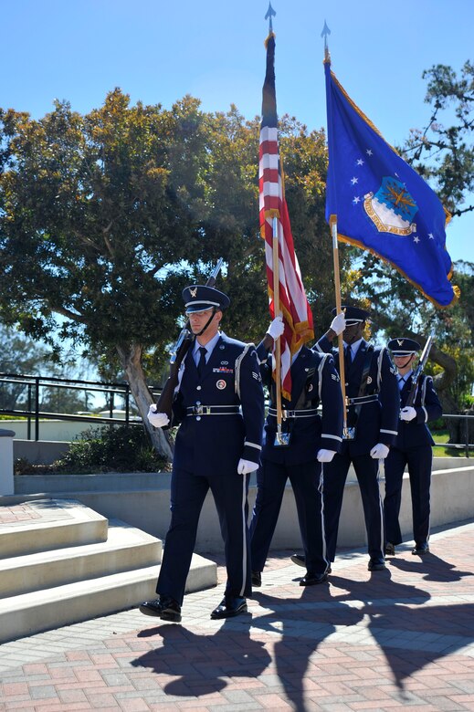 VANDENBERG AIR FORCE BASE, Calif. -- Vandenberg Color Guard members march in to post the colors during the 30th Operations Group change of command ceremony here Tuesday, June 25. The 30 OG commands and controls the Western Range and directs range resources in support of space launches, missile test launches and aeronautical and space surveillance operations. (U.S. Air Force photo/Michael Peterson)
