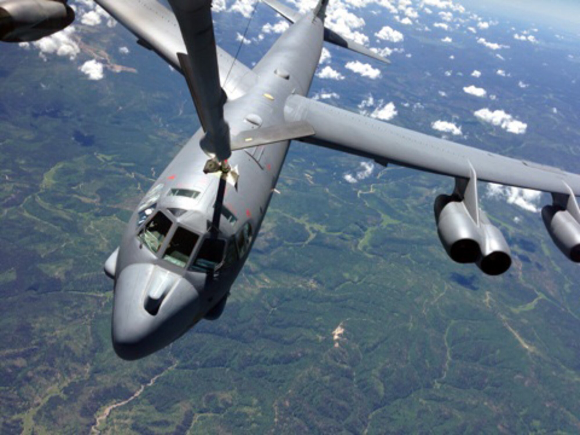 A B-52 Stratofortress assigned to the 5th Bomb Wing, Minot Air Force Base, N.D., is refueled by a KC-135 Stratotanker from McConnell Air Force Base, Kan., during an air refueling training mission June 27, 2013.  The KC-135 was being operated by an aircrew made up of Reservists from the 931st Air Refueling Group at McConnell.  Air refueling training missions ensure that both the refueling and receiving aicrews maintain proficiency in air refueling operations, which allows the U.S. Air Force to extend its reach around the globe.  (U.S. Air Force photo by Senior Master Sgt. Ray Lewis)