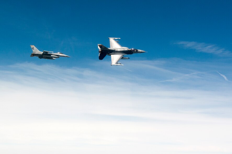 On Thursday, June 20, 2013 F-16 Fighting Falcon aircraft from the 132nd Fighter Wing (132FW), Des Moines, Iowa are seen flying in the skies over Iowa.  The 132FW is currently taking on a new mission to operate MQ-9 Reaper aircraft.  (U.S. Air National Guard photo by Staff Sgt. Linda K. Burger/Released)