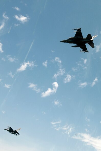 On Thursday, June 20, 2013 F-16 Fighting Falcon aircraft from the 132nd Fighter Wing (132FW), Des Moines, Iowa are seen flying in the skies over Iowa.  The 132FW is currently taking on a new mission to operate MQ-9 Reaper aircraft.  (U.S. Air National Guard photo by Staff Sgt. Linda K. Burger/Released)