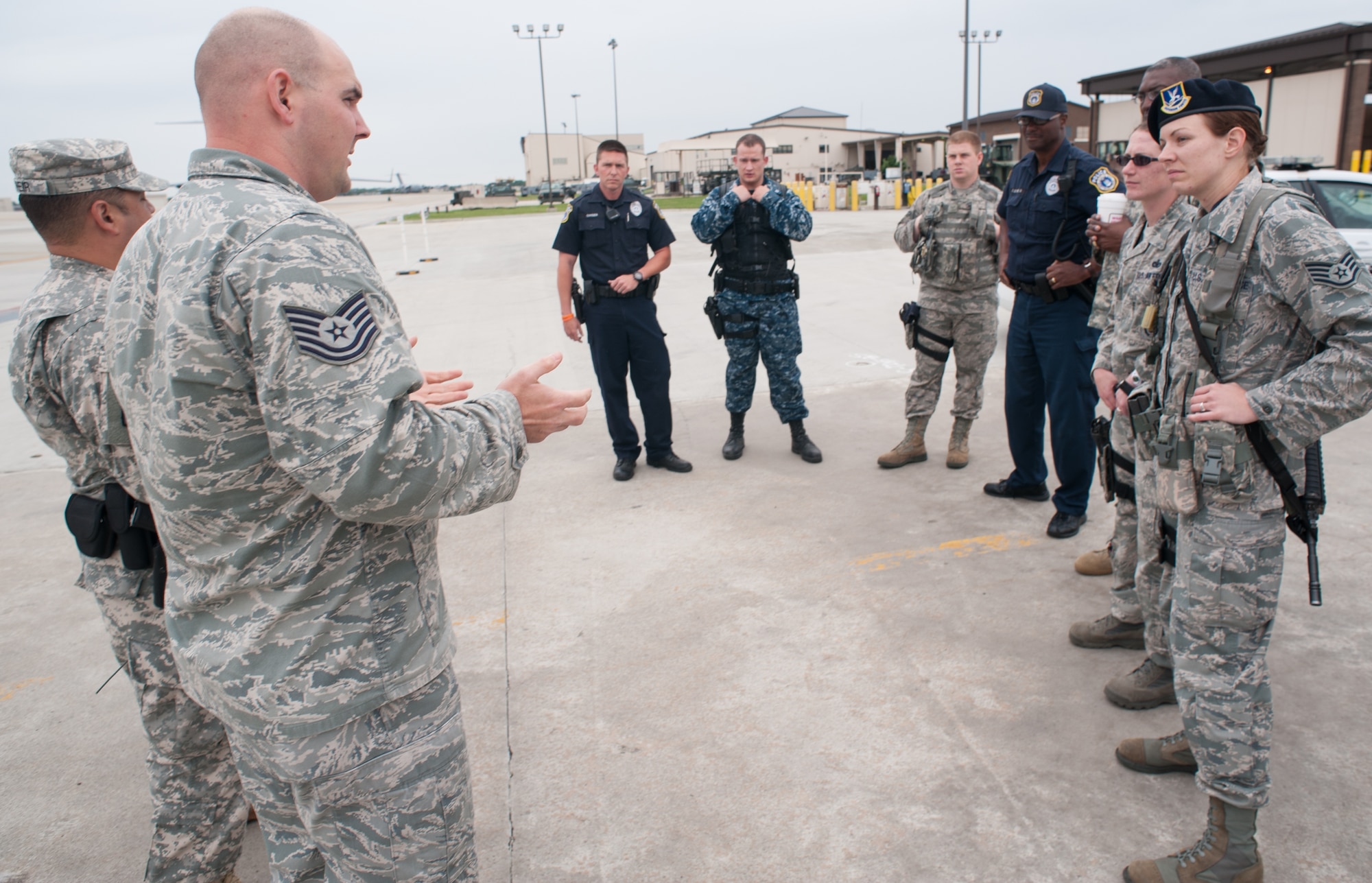 Tech. Sgt. Joshua White, 87th Security Forces Squadron flight chief, goes over his observations from the flightline training conducted with 87th SFS members and Army reservists from the 313th Military Police Detachment based in Las Vegas June 14, 2013, at Joint Base McGuire-Dix-Lakehurst, N.J. The Soldiers were conducting their annual training at JB MDL. (U.S. Air Force photo by Russ Meseroll/Released)