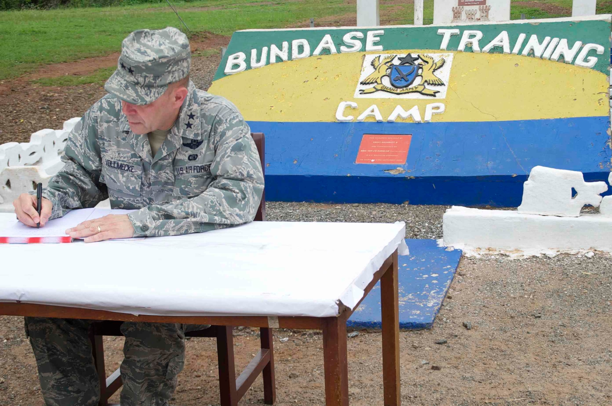 Maj. Gen. Eric Vollmecke, Western Accord 13 deputy exercise director, signs the distinguished visitors log while touring the Bundase training camp near Accra, Ghana, June 19. Western Accord 13 is a mutually beneficial exercise hosted by U.S. Army Africa that brings together the Economic Community of West African States and the US Army to have increased capabilities to support regional peacekeeping operations. (Photos by: Sgt. Tyler Sletten, 116th Public Affairs Detachment)
