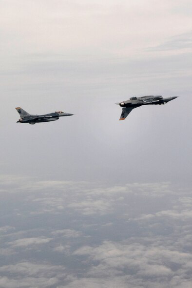 On Friday, June 21, 2013 F-16 Fighting Falcon aircraft from the 132nd Fighter Wing (132FW), Des Moines, Iowa are seen flying in the skies over Iowa.  The 132FW is currently taking on a new mission to operate MQ-9 Reaper aircraft.  (U.S. Air National Guard photo by Maj. Todd Glade/Released)