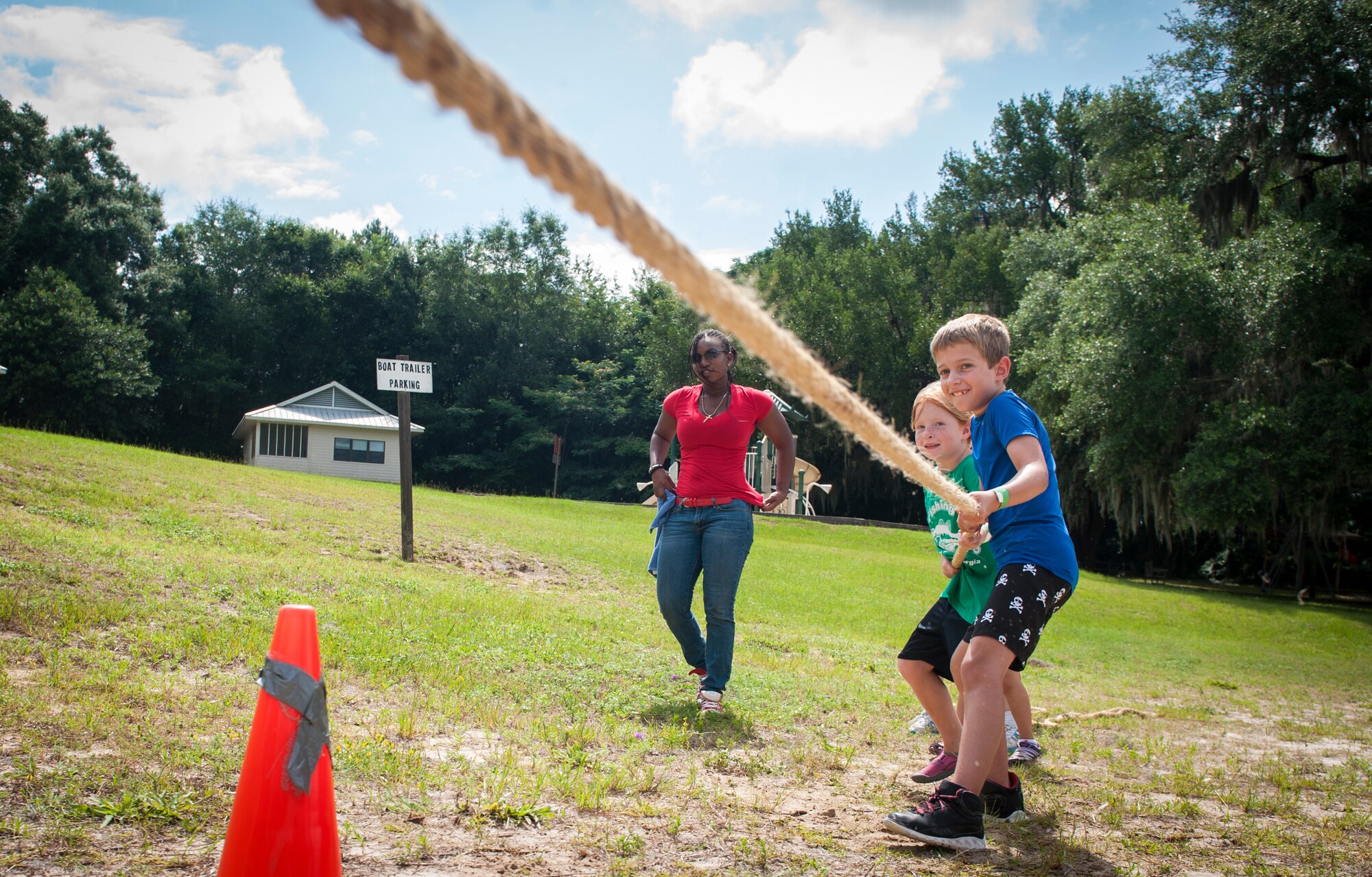 Children from Moody Air Force Base, Ga., play tug-of-war during a Children’s Olympics event June 21, 2013 at Grassy Pond in Lake Park, Ga. The Moody Youth Center hosted the Children’s Olympics, which was made up of 15 different events. (U.S. Air Force photo by Senior Airman Jarrod Grammel/Released)