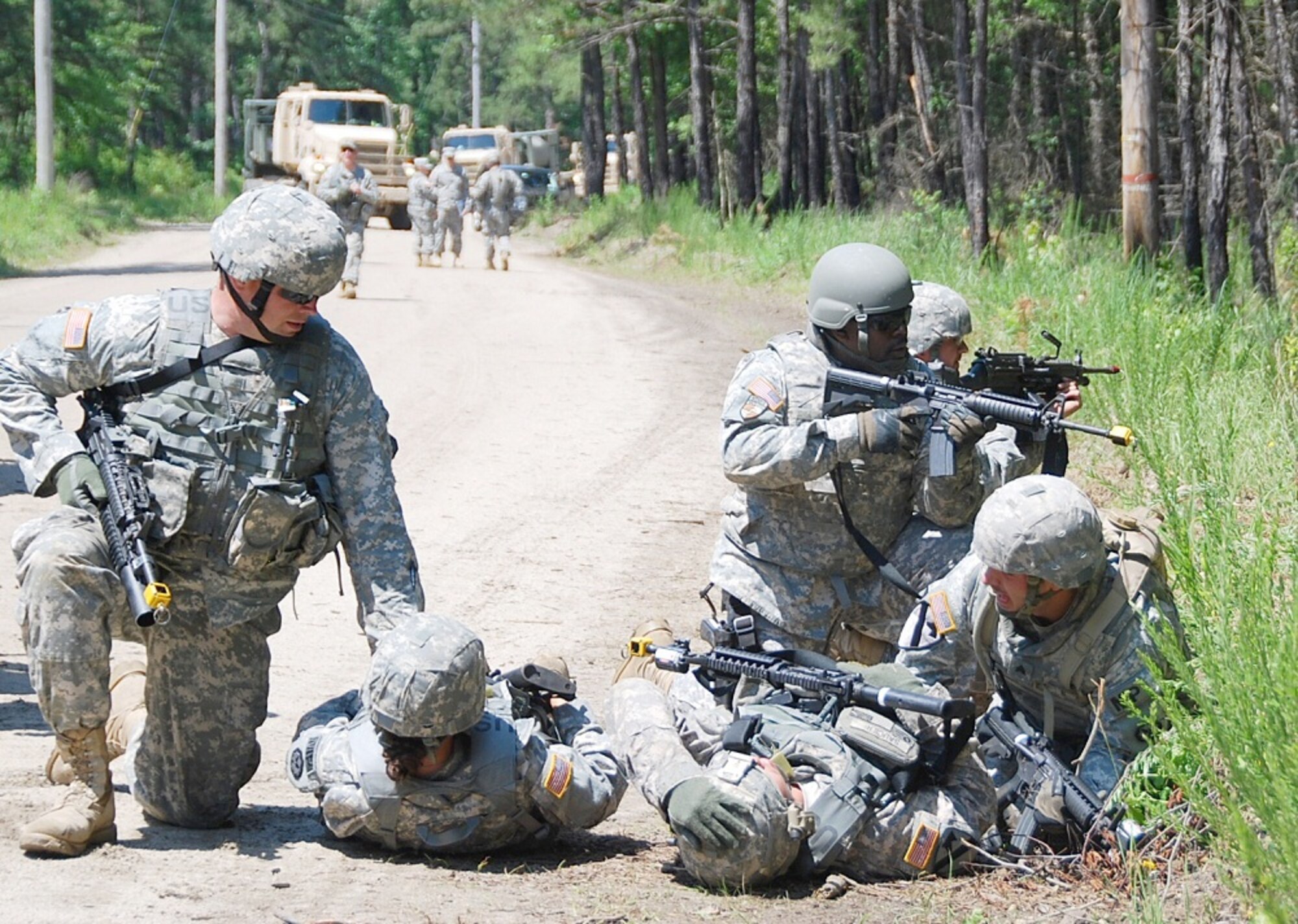 Military police of the 351st Military Police Company from Ocala, Fla., return fire at an opposing force and protect the unit's wounded after their convoy travelling on Route Mongoose on a security mission. The attack came after another convoy became held up by a road block and vehicle-borne IED detonated. The two attacks held up by the two convoys and created a temporary traffic jam in the area.
(U.S. Army photo by Capt. Antonia Greene-Edwards/Released)