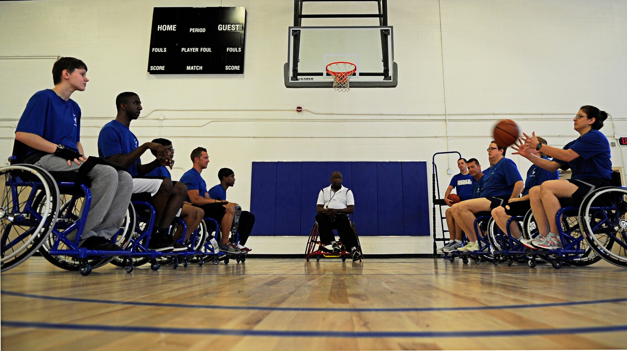 Wounded Warriors learn to play wheelchair basketball during an Air Force Wounded Warrior Adaptive Sports Training Camp at the West Fitness Center at Joint Base Andrews, Md., June 26, 2013. (U.S. Air Force photo/Senior Airman Lauren Main)