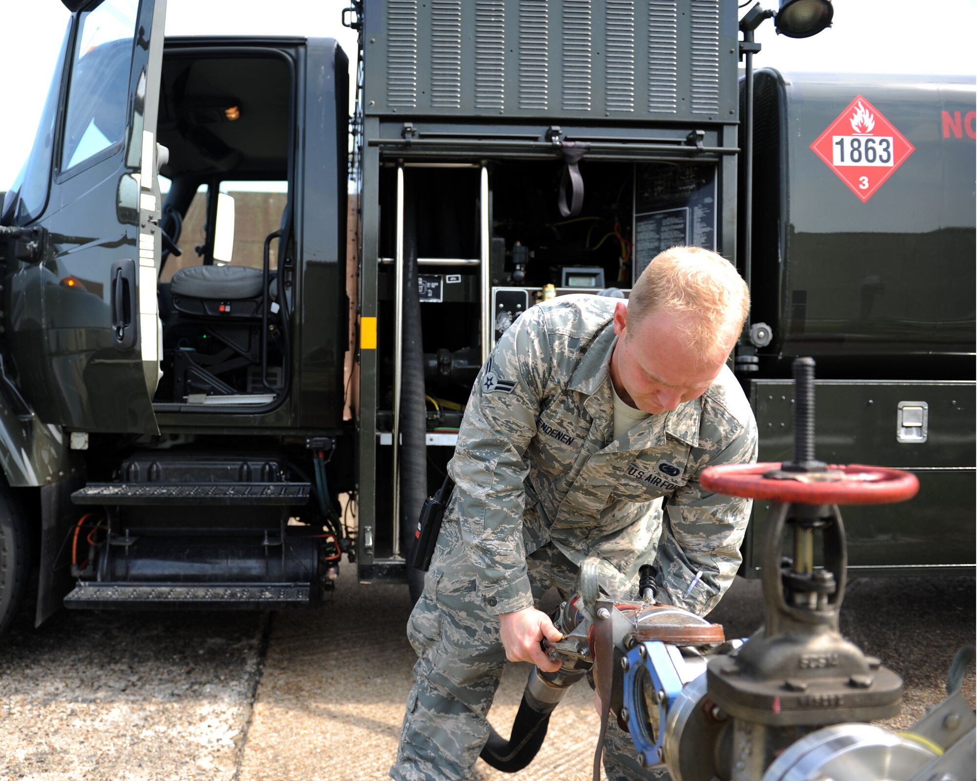 Airman 1st Class Nicholas Clendenen, 100th Logistics Readiness Squadron preventative maintenance technician from Colorado Springs, Colo., prepares to drain the tank of an R-11 refueling truck June 26, 2013, on RAF Mildenhall, England, so that it’s light enough to undergo maintenance. Maintaining the R-11 refueling trucks is essential to keeping up the flow of Jet Propulsion grade 8 fuel to aircraft and equipment. (U.S. Air Force photo by Airman 1st Class Preston Webb/Released)