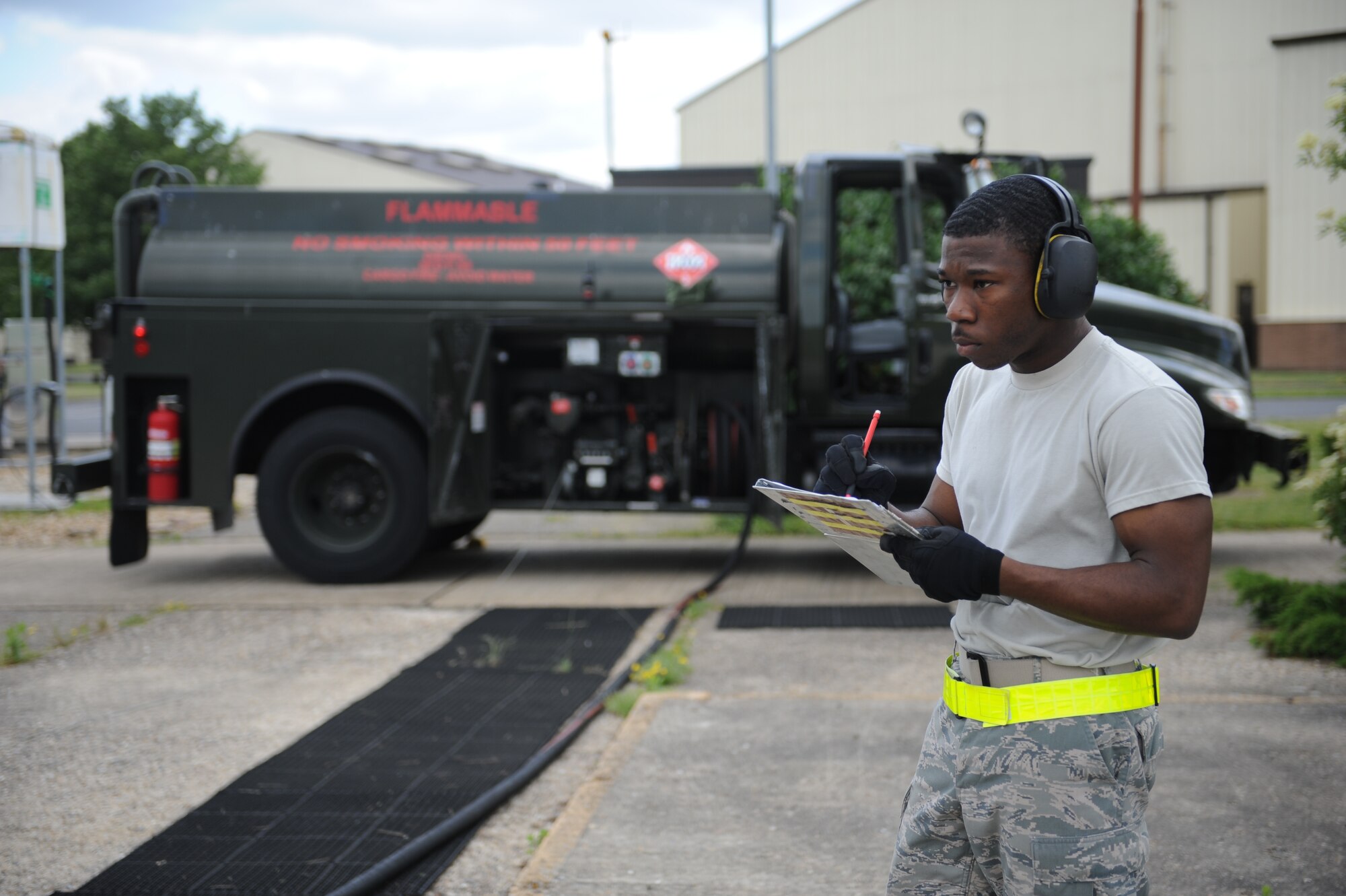 Airman 1st Class Justin Smith, 100th Logistics Readiness Squadron Fuels Distribution journeyman from Batesville, Miss., monitors the flow of fuel from an R-11 refueling truck June 25, 2013, on RAF Mildenhall, England. An R-11 refueling truck is used to transport 30,000 pounds or less of Jet Propulsion grade 8 fuel to aircraft, and is essential to keeping aircraft fueled and ready to carry out the mission. (U.S. Air Force photo by Airman 1st Class Preston Webb/Released)