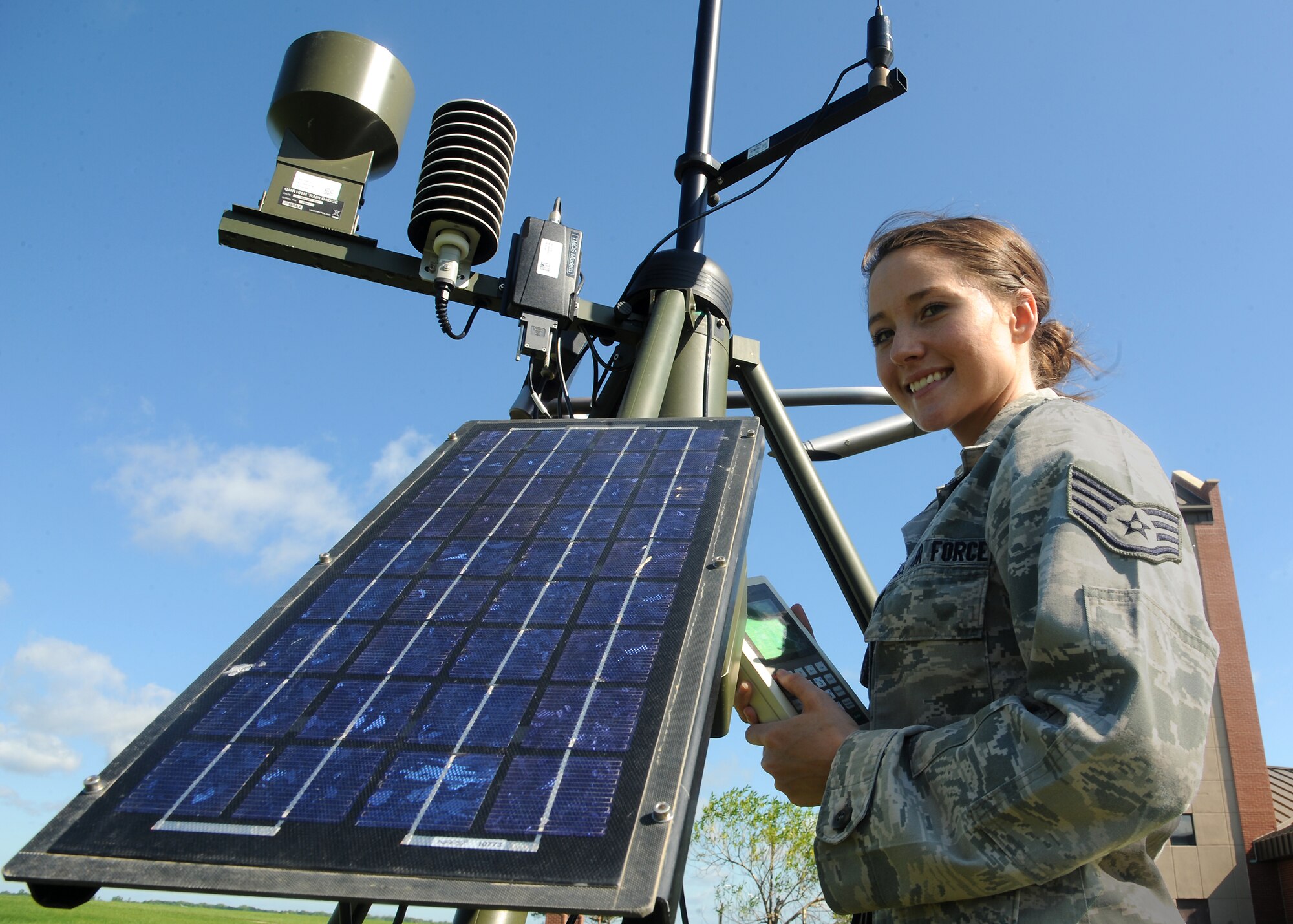 Staff Sgt. Amanda Davidson, 319th Operations Support Squadron weather forecaster, configures and retrieves data from the primary handle controller which monitors weather conditions on June 26, 2013, on Grand Forks Air Force Base, N.D. Davidson was named the Warrior of the Week for the fourth week of June. (U.S. Air Force Photo/Airman 1st Class Xavier Navarro)
