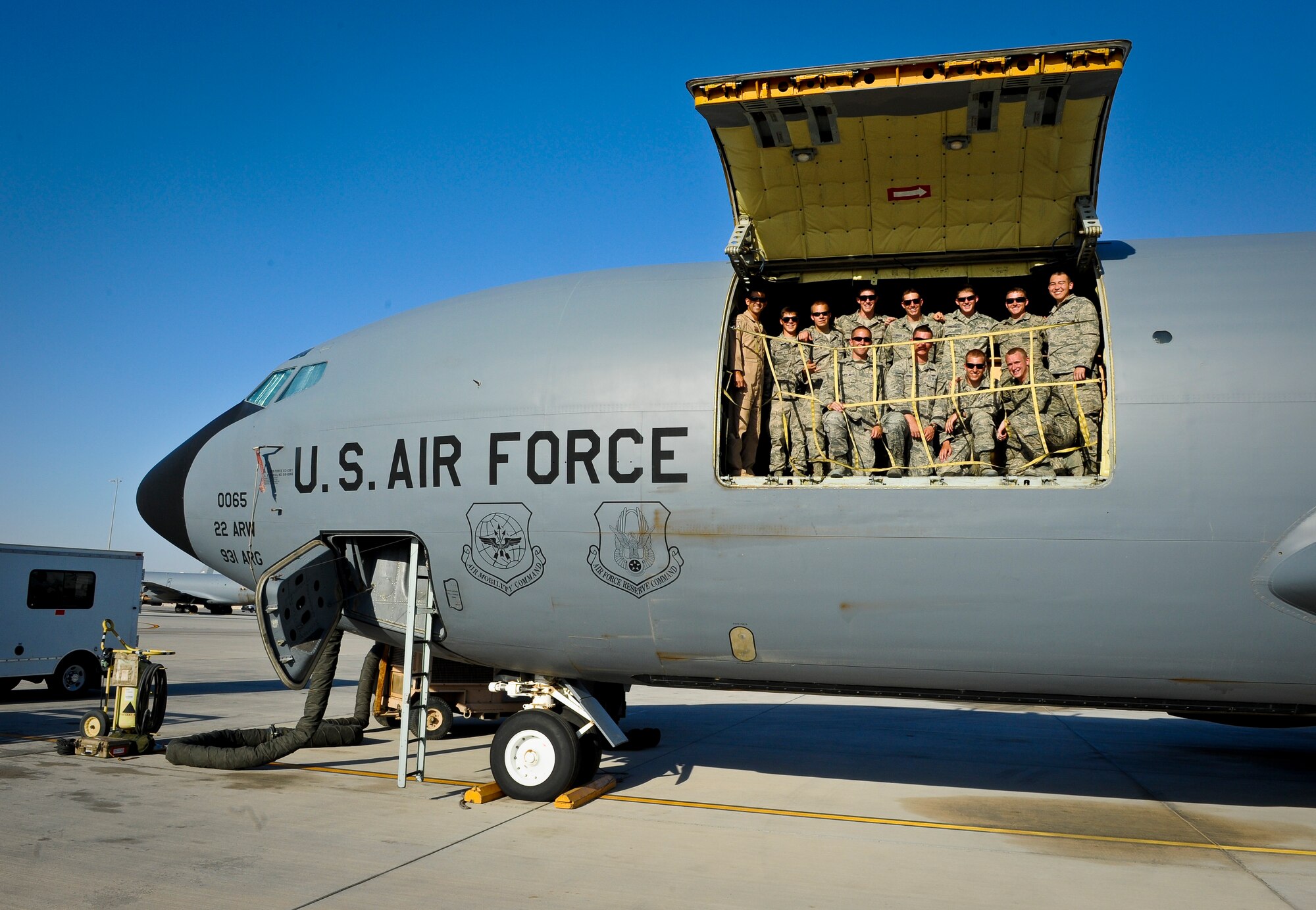 U.S. Air Force Academy cadets pose for a photo on board a KC-135 Stratotanker during their tour of the aerial refueler and other agencies across the base at the 379th Air Expeditionary Wing in Southwest Asia, June 24, 2013. More than 40 USAFA cadets visited the 379th AEW in June observing deployed operations first-hand and interacting with deployed U.S. and coalition forces. (U.S. Air Force photo/Senior Airman Benjamin Stratton)