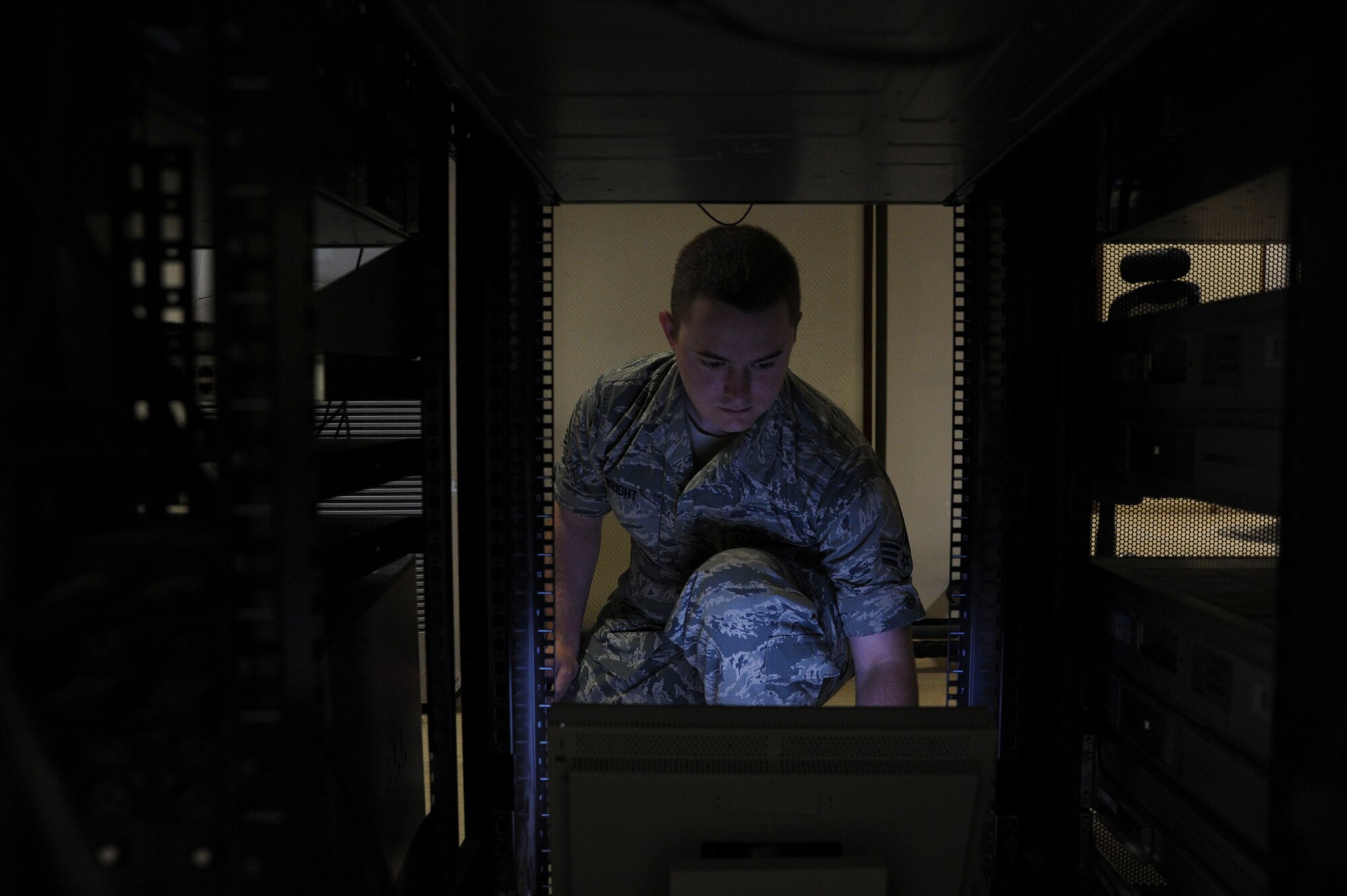 Senior Airman Andrew Wright manages the feed for the commander’s access channel at the 379th Air Expeditionary Wing in Southwest Asia, June 27, 2013. The 379th Expeditionary Communications Squadron Communications Focal Point works closely with the Network Control Center to resolve communication issues for customers. Wright is a 379th ECS NCC technician deployed from Joint Base Elmendorf-Richardson, Alaska. (U.S. Air Force photo/Senior Airman Bahja J. Jones) 