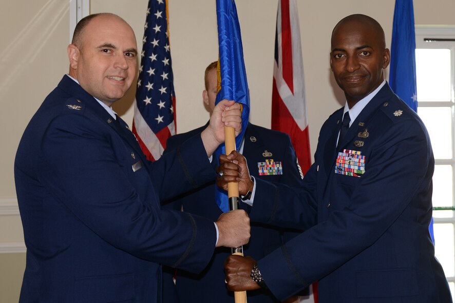 Lt. Col. Cornell Burgess assumes command of the 423rd Force Support Squadron from Col. Steve Sweeney, 423rd Air Base Group commander, in a change of command ceremony at the RAF Alconbury June 26. (U.S. Air Force photo by Tech. Sgt. Chrissy Best)