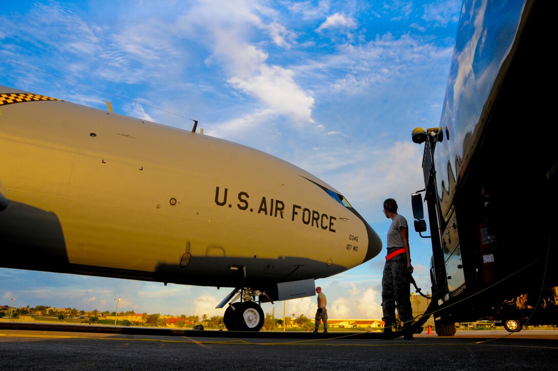 Airman 1st Class Ashley Lee, 36th Logistics Readiness Squadron fuels distribution operator, helps maintainers refuel a KC-135 Stratotanker, June 26, 2013, on Andersen Air Force Base, Guam. (U.S. Air Force photo by Airman 1st Class Marianique Santos/Released)