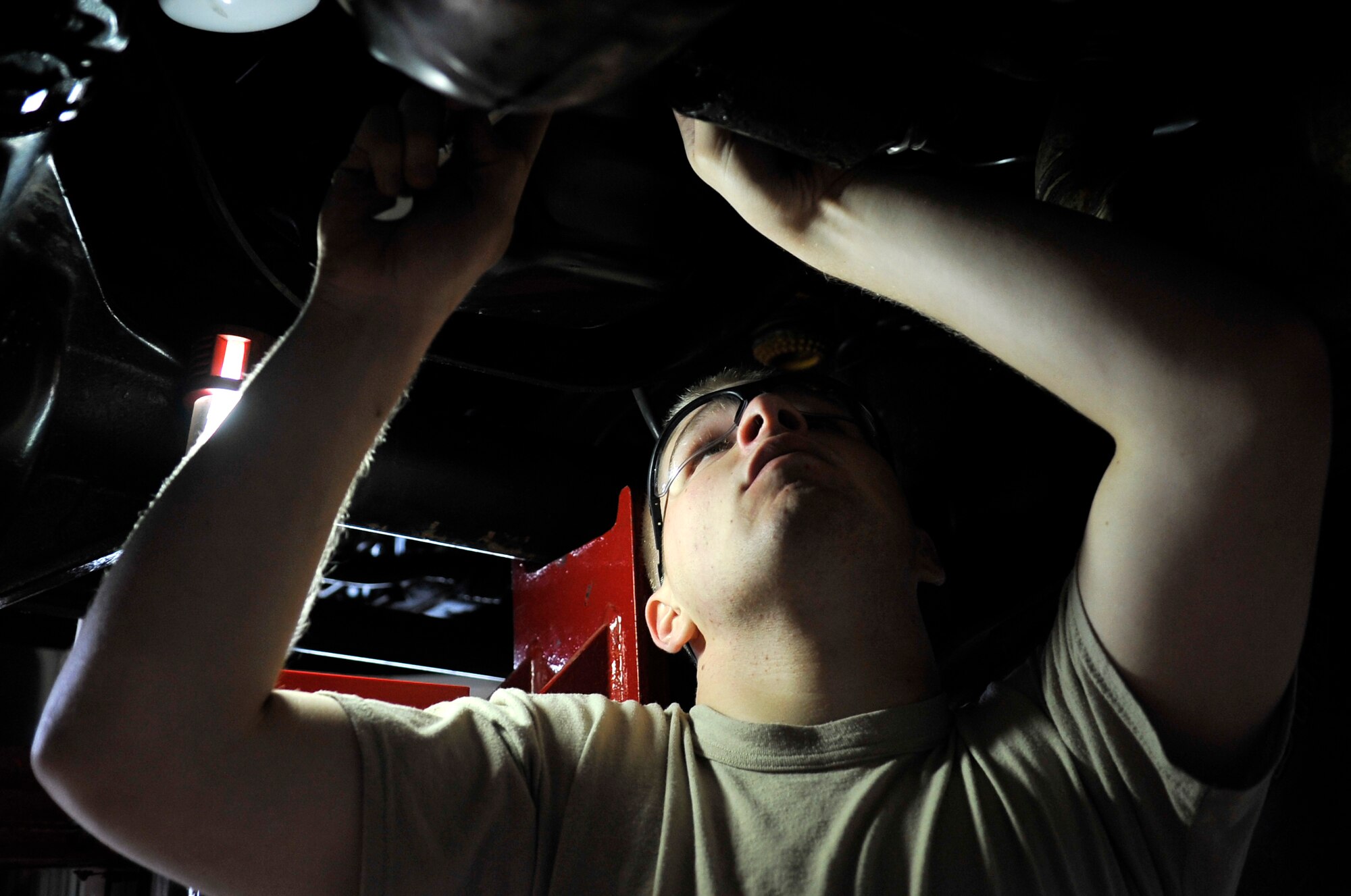 U.S. Air Force Airman 1st Class Curtis King, 35th Logistics Readiness Squadron vehicle maintenance apprentice, performs maintenance on a pick-up truck at Misawa Air Base, Japan, June 27, 2013. The Vehicle Management Flight is responsible for inspecting, repairing, modifying and accounting for all government-owned vehicles on base. (U.S. Air Force photo by Airman 1st Class Zachary Kee)