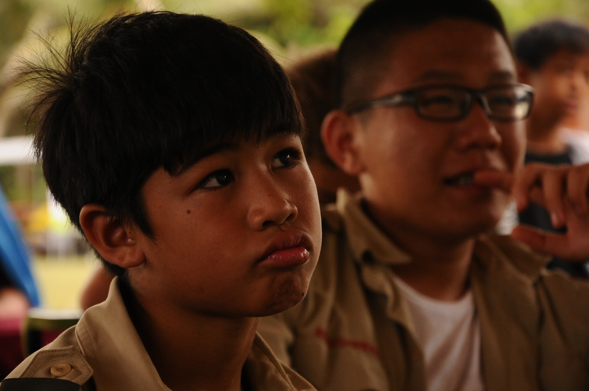Scouts listen during a discussion on values at the annual Boy Scout Summer Camp at Andersen Air Force Base, Guam, June, 19. 81 Boy Scouts and 26 adult volunteers participated in the camp focused on outdoor skills and character development. (U.S. Air Force photo by Airman 1st Class Emily A. Bradley/Released)