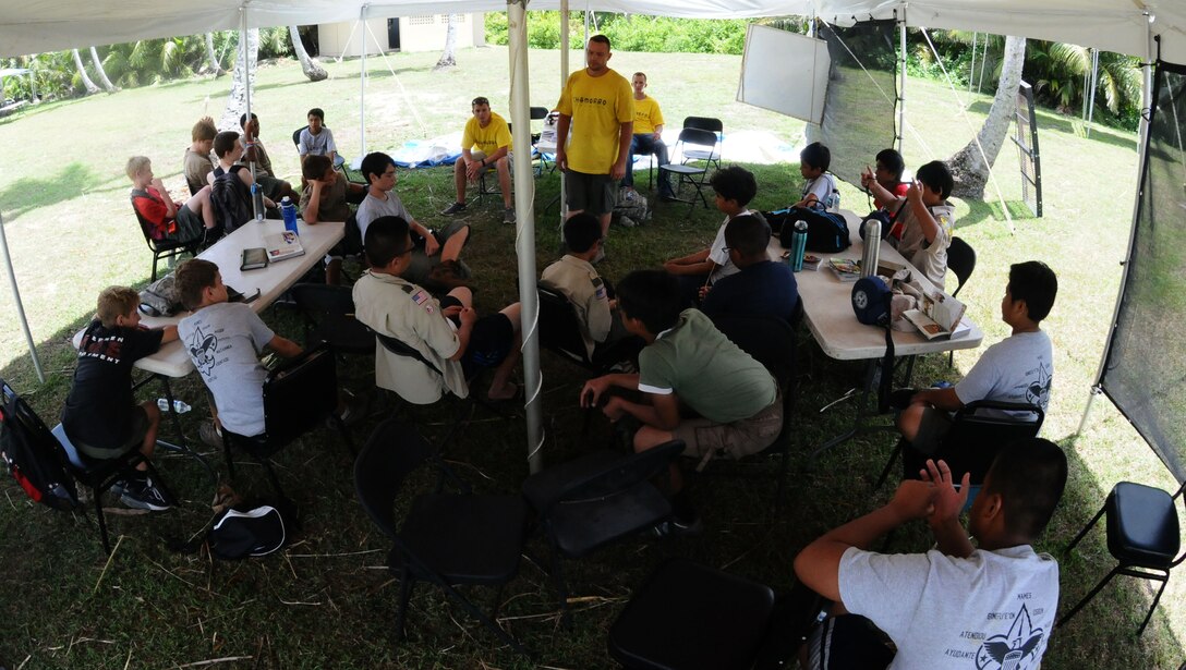 Boy Scouts from seven different troops on Guam participate in a group discussion about values during the annual Boy Scout Summer Camp on Andersen Air Force Base, Guam, June 19. 81 Boy Scouts and 26 adult volunteers participated in the camp focused on outdoor skills and character development. (U.S. Air Force photo by Airman 1st Class Mariah Haddenham/Released)