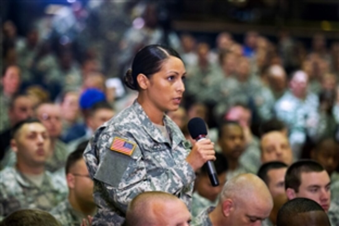 Army Cpl. Franco asks a question about the Army’s combatives program to Army Chief of Staff Gen. Ray Odierno and Sgt. Maj. of the Army Raymond F. Chandler III during a town hall meeting on Joint Base Lewis-McChord, Wash., June 26, 2013.