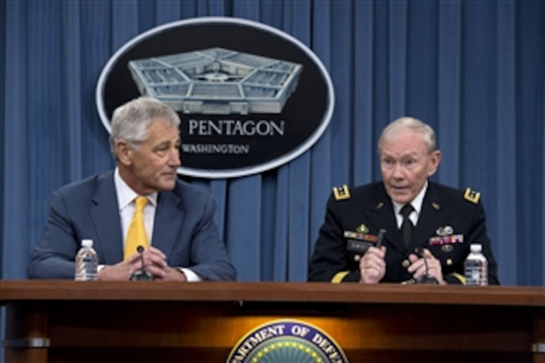 Secretary of Defense Chuck Hagel, left, and Chairman of the Joint Chiefs of Staff Gen. Martin Dempsey brief the press at the Pentagon in Arlington, Va., on June 26, 2013. Hagel announced that President Barack Obama has nominated Dempsey and Vice Chairman of the Joint Chiefs of Staff Adm. James Winnefeld Jr. to a second two-year term.   