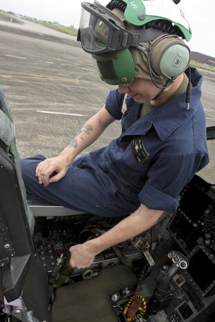 Lance Cpl. James C. Riley, A fixed-wing aircraft safety equipment mechanic with Marine All-Weather Fighter Attack Squadron 242, inspects the ejection seat of an F/A-18D hornet June 12 during Exercise Haribon Tempest 2013. Riley inspects, maintains and repairs the aircraft’s safety equipment and systems. The focus of HT13 is to improve tactical-level military proficiency and enhance U.S.- Philippine interoperability and combined abilities.