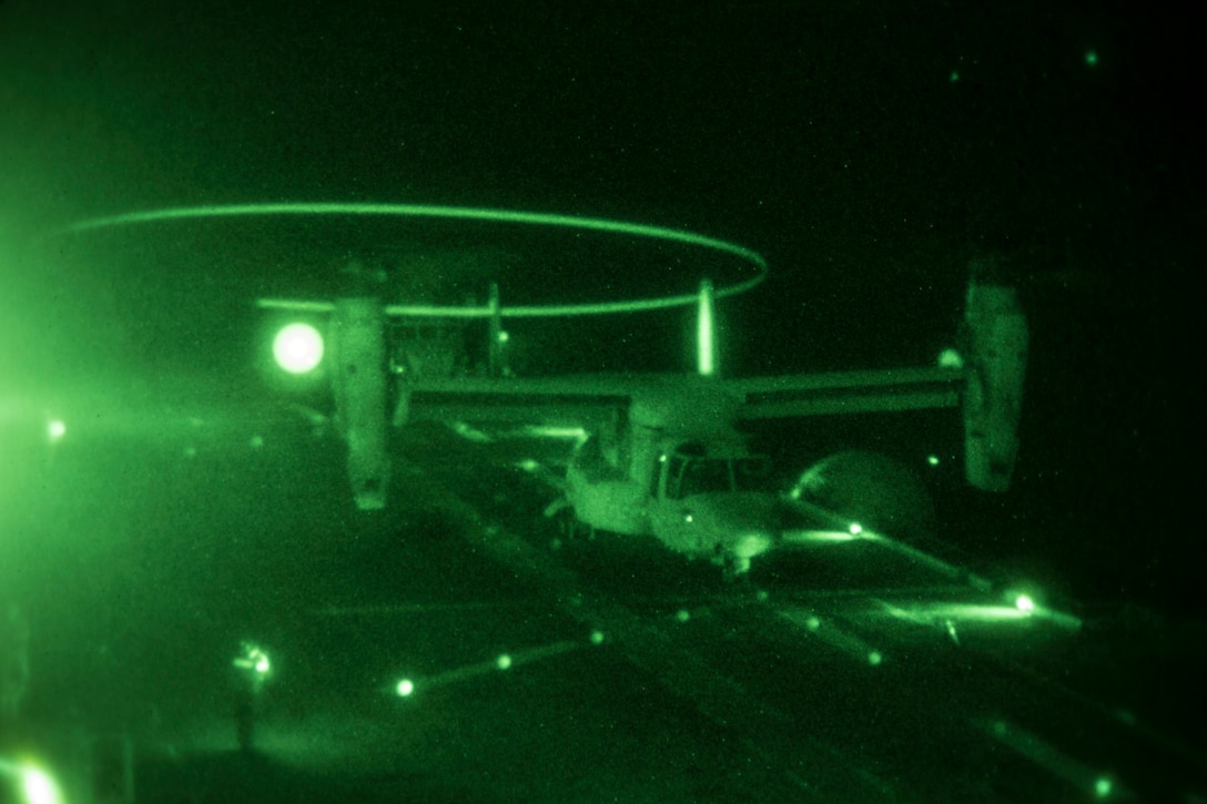 An MV-22B Osprey assigned to Marine Medium Tiltorotor Squadron (VMM) 266 (Reinforced), 26th Marine Expeditionary Unit (MEU), lands aboard the USS Kearsarge (LHD 3), during nighttime flight operations at sea, June 27, 2013. The 26th MEU is a Marine Air-Ground Task Force forward-deployed to the U.S. 5th Fleet area of responsibility aboard the Kearsarge Amphibious Ready Group serving as a sea-based, expeditionary crisis response force capable of conducting amphibious operations across the full range of military operations. (U.S. Marine Corps photograph by Sgt. Christopher Q. Stone, 26th MEU Combat Camera/Released)