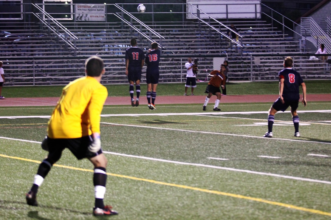 Defensive players from Team USA Armed Forces jump in attempt to block a kick from a Bethesda player late in the second half of their game held at the 11-area field here June 24. Team USA Armed Forces won 5-1 after 90 minutes of play. Team USA Armed Forces is scheduled to play in the 1st Annual Military World Cup held in Baku, Azerbaijan.