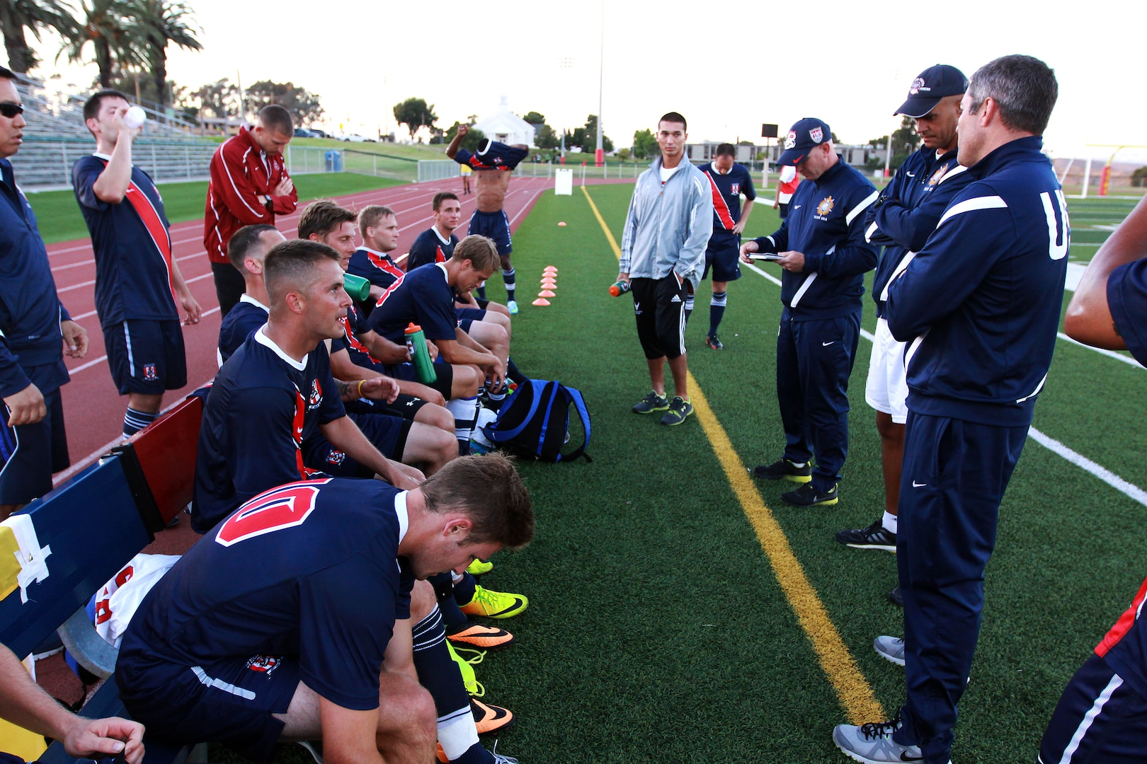 Both Team USA Armed Forces and Bethesda University join together for a  group picture after their friendly game at the 11-area field on June 24.  Team USA has played 10 friendly games