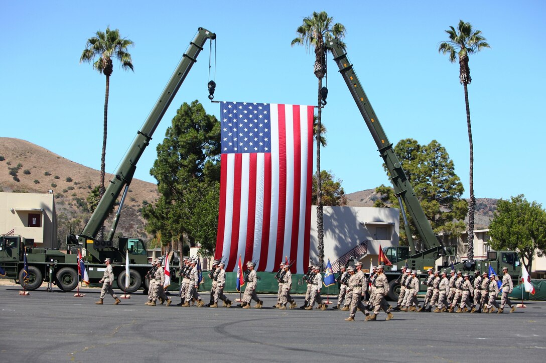 Marines with 1st Maintenance Battalion, Combat Logistics Regiment 15, 1st Marine Logistics Group, march on the parade deck during their battalion’s change of command ceremony aboard Camp Pendleton, Calif., June 27, 2013. During the ceremony, Lt. Col. Christian D. Richardson, the outgoing commanding officer, relinquished his command of the battalion to Lt. Col. Mark T. Donar.