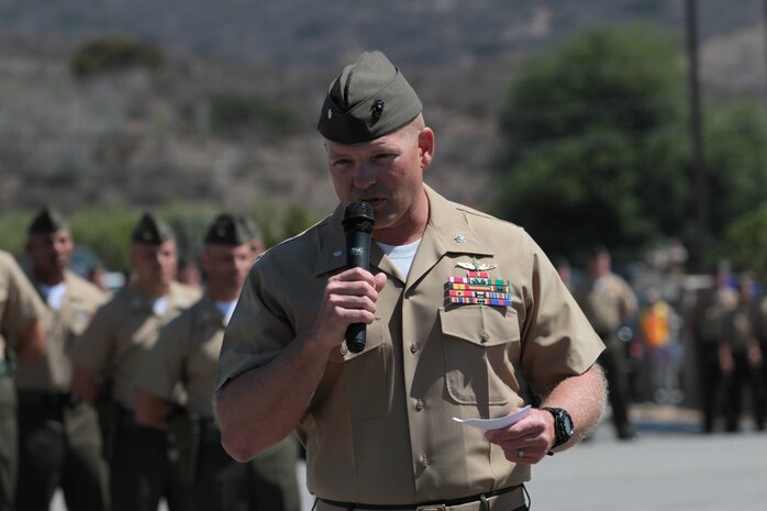 Lieutenant Col. Christeon C. Griffin, the former commanding officer of 3rd Battalion, 5th Marine Regiment, speaks during a change of command ceremony at the Camp San Mateo parade deck here, June 26, 2013. Griffin, a native of Mims, Fla., said the battalion's rich legacy of service helped inspire the Marines to work hard and uphold that legacy. During his tenure as commanding officer, the battalion deployed with the 15th Marine Expeditionary Unit, visiting East Timor, Saudi Arabia, Kuwait, the United Arab Emirates and other nations.
(U.S. Marine Corps photo by Sgt. Jacob H. Harrer)