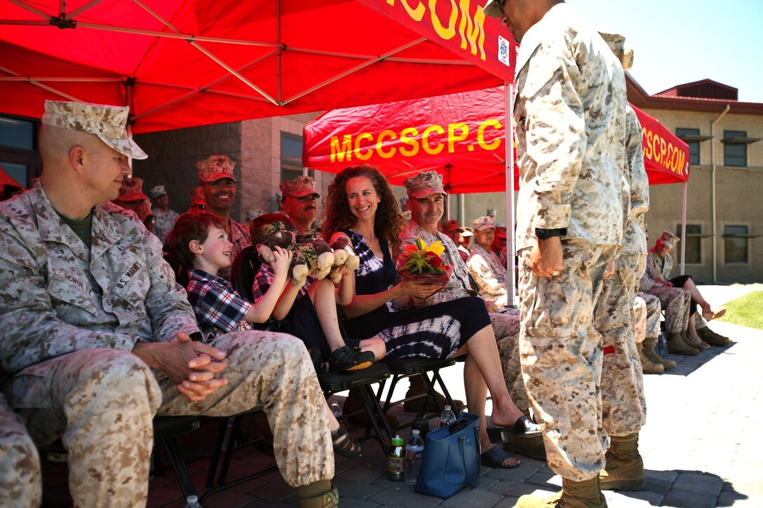 Samuel Kraft, son of Col. Erik B. Kraft, incoming commanding officer, Combat Logistics Regiment 17, 1st Marine Logistics Group, plays 
with his new memento during his father’s assumption of command ceremony aboard Camp Pendleton, Calif., June 26, 2013. “I’m extremely fortunate for stepping up and being able to command (the regiment),” said Kraft. “I’ve been truly blessed to be here.”