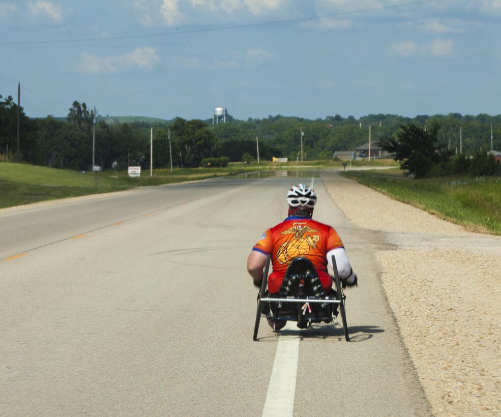 Michael Frazier, a cyclists and wounded warrior with Team Walter Reed Bethesda from Lower Burrell, Penn., cycles during the 32nd Annual Race Across America, June 19. Michael Frazier joined Team Walter Reed Bethesda to face a new challenge with fellow wounded warriors.