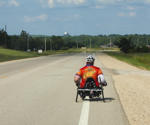 Michael Frazier, a cyclists and wounded warrior with Team Walter Reed Bethesda from Lower Burrell, Penn., cycles during the 32nd Annual Race Across America, June 19. Michael Frazier joined Team Walter Reed Bethesda to face a new challenge with fellow wounded warriors.