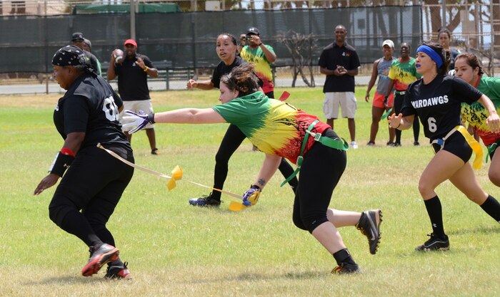 Wahine Koa player Malori Anthony steals the flag off Wardawgz quarterback Luretta “Old School” Palmer as she tries to advance down the field with the ball during a Hawaii Gridiron League flag football game at Kapiolani Park, June 23, 2013. (U.S. Marine Corps photo by Kristen Wong)