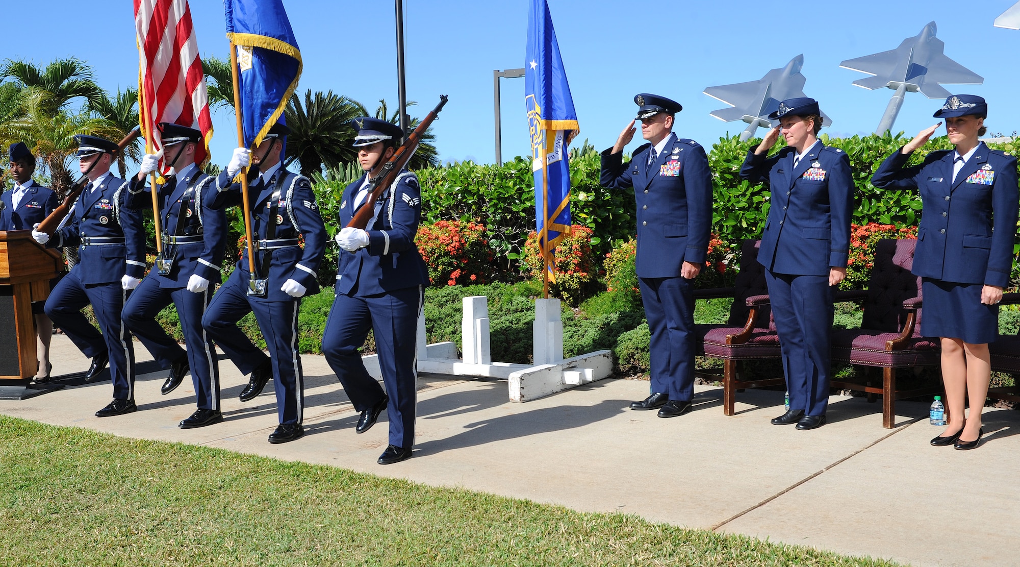 Members of the 15th Wing Honor Guard present the colors prior to the singing of the national anthem at the 15th Comptroller Squadron change of command ceremony at the Missing Man Formation on Joint Base Pearl Harbor-Hickam, Hawaii, June 27, 2013. During the ceremony, Maj. Amanda B. Evans assumed command from Lt. Col. Theresa Sheppard. (U.S. Air Force photo/Tech. Sgt. Jerome S. Tayborn)