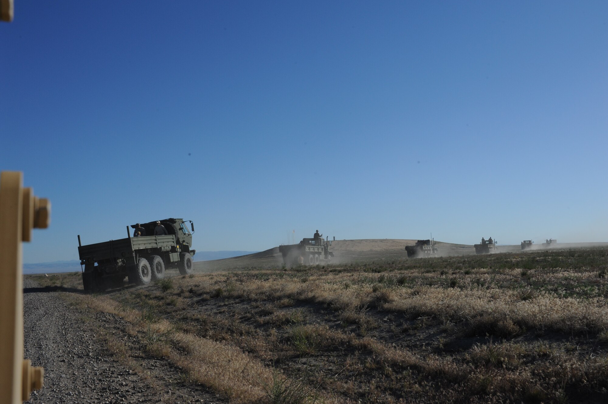 Members from the 366th Fighter Wing drive on the Saylor Creek Range complex near Mountain Home Air Force Base, Idaho, June 5, 2013. The month of June is annual range clearance month for the base and explosive ordnance disposal Airmen removed more than 35 tons of munitions from the range complex. (U.S. Air Force photo by Senior Airman Benjamin Sutton/Released) 
