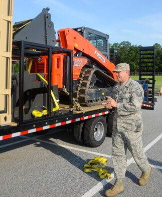 Master Sgt. Joel Furlough, 116th Civil Engineer Squadron, Georgia Air National Guard, performs an inventory and acceptance inspection of a route clearance kit at Robins Air Force Base, Ga., June 27, 2013.  The civil engineering arm of the 116th Air Control Wing will use the kits, consisting of multi-purpose Kubota tractors, when called upon to quickly respond to disasters in their region.  The equipment gives the unit the capability to clear debris in the area of a disaster so emergency operations personnel can respond. (U.S. Air National Guard photo by Capt. Pamela Stauffer/Released)