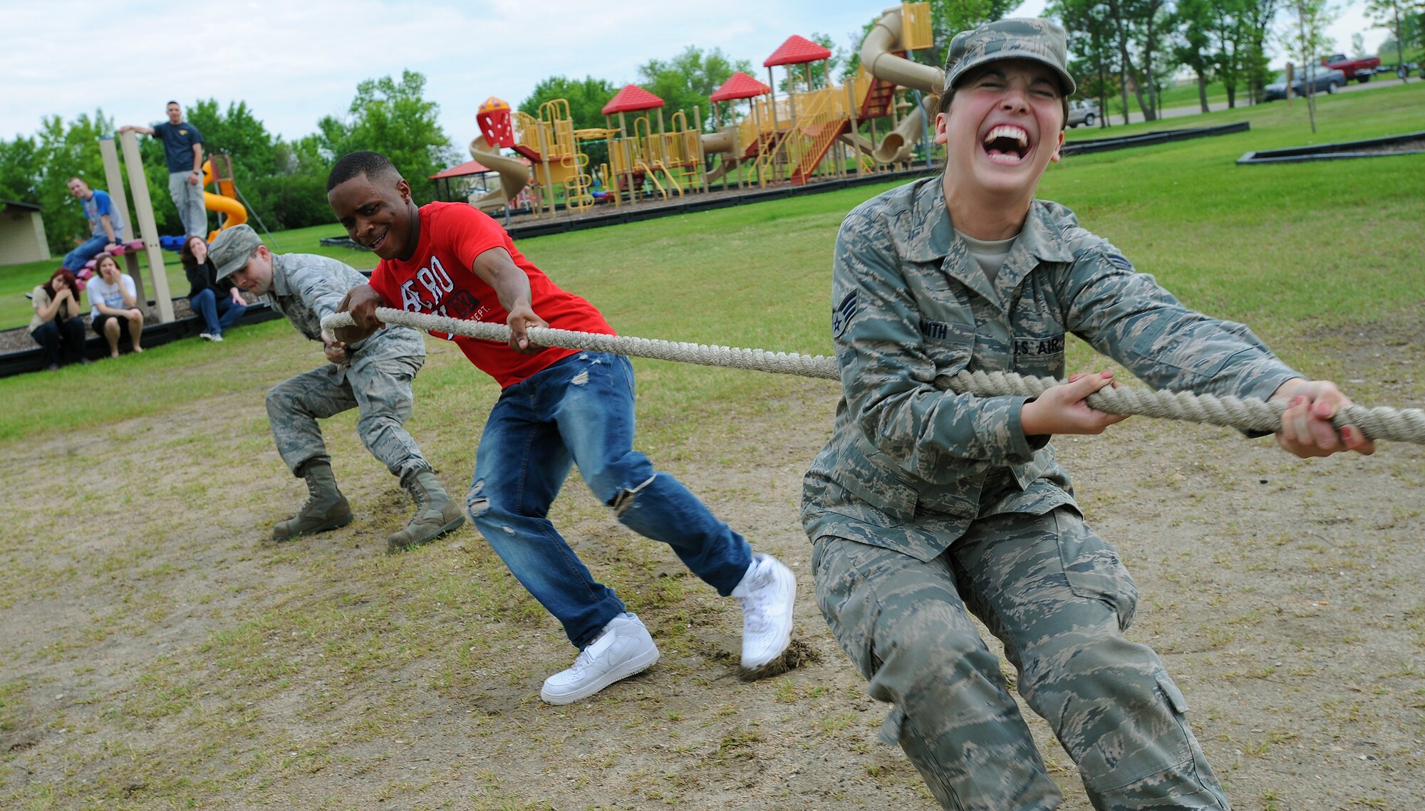 Airmen take part in a tug-of-war contest during a get-together hosted by The Minot Enlisted Airmen’s Council at Minot Air Force Base’s Bud Ebert Park, June 21, 2013. The MEAC kick-started the summer with a party for all younger-tier Airmen, which included games, food, and other entertainment. (U.S. Air Force photo/Senior Airman Jose L. Hernandez)