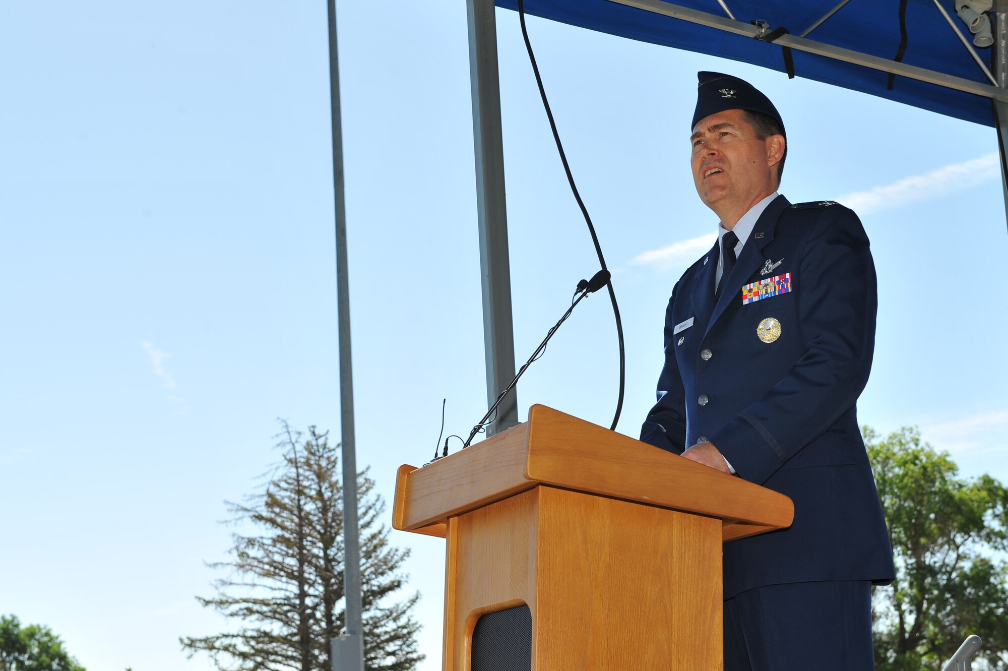 Col. Daniel D. Wright III, 460th Space Wing commander, addresses members of the 460th SW June 28, 2013, during the 460th SW change of command ceremony on Buckley Air Force Base, Colo. This is the third time Wright has been stationed on Buckley, having been stationed here in 1993 and 2005 as part of the 2nd Space Warning Squadron. (U.S. Air Force photo by Senior Airman Phillip Houk/Released)