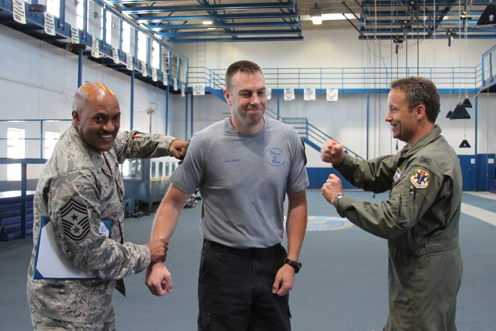 Chief Master Sgt. Avery Woolridge, 12th Flying Training Wing commander chief master sergeant, and Col. Gerald Goodfellow, 12th Flying Training Wing commander, tack on Master Sgt. Dave Siemiet’s master sergeant stripes on June 26, 2013 at the U.S. Air Force Academy, Colo.  Siemiet was selected for the promotion through the Stripes for Exceptional Performers, also known as the STEP program.  (U.S. Air Force photo by Tech. Sgt. JT Valente)