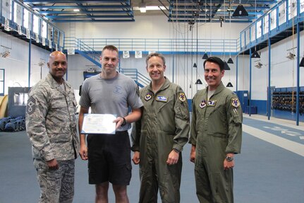 Chief Master Sgt. Avery Woolridge, 12th Flying Training Wing command chief master sergeant; Master Sgt. Dave Siemiet, 98th Flying Training Squadron jumpmaster; Col. Gerald Goodfellow, 12th FTW commander; and Lt. Col. Sean McLay, 98th FTS commander, pose for a photo after the surprise promotion of Siemiet to master sergeant.  Siemiet was selected for the promotion through the Stripes for Exceptional Performers, also known as the STEP program, on June 26, 2013 at the U.S. Air Force Academy, Colo.  (U.S. Air Force photo by Tech. Sgt. JT Valente)