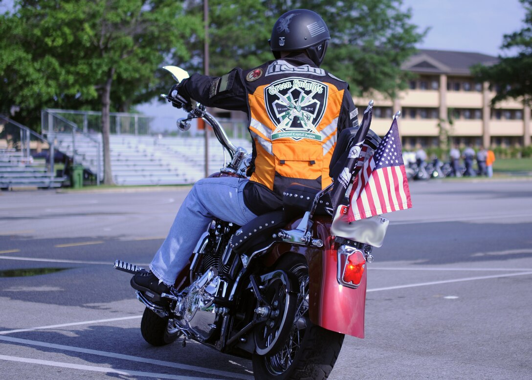 Green Knights Chapter 20 President Chris Orbits demonstrates his control of his Harley-Davidson motorcycle while in attendance for Team Andrews Motorcycle Safety Day here Friday, June 28. Many motorcyclists take part in the event to spread motorcycle safety awareness and enjoy the festivities. (U.S. Air Force Photo by Airman 1st Class Joshua R. M. Dewberry)