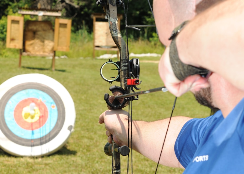 A service member participates in the archery portion of the Air Force Warrior Adaptive Sports Camp held at Joint Base Andrews June 26 and 27. As part of the Air Force's Wounded Warrior Program, the camp introduced adaptive sports to wounded warriors during the earliest stages of their recovery. (U.S. Air Force photo/Airman 1st Class Aaron Stout)