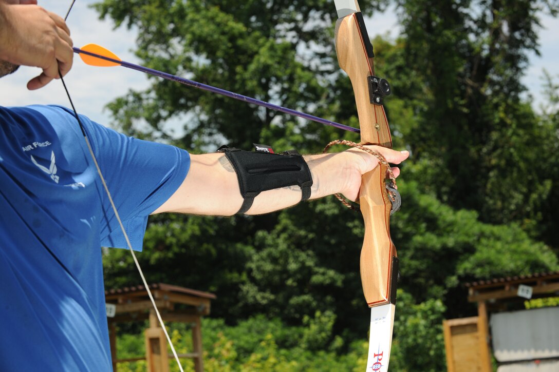 A service member participates in the archery portion of the Air Force Warrior Adaptive Sports Camp held at Joint Base Andrews June 26 and 27. As part of the Air Force's Wounded Warrior Program, the camp introduced adaptive sports to wounded warriors during the earliest stages of their recovery. (U.S. Air Force photo/Airman 1st Class Aaron Stout)