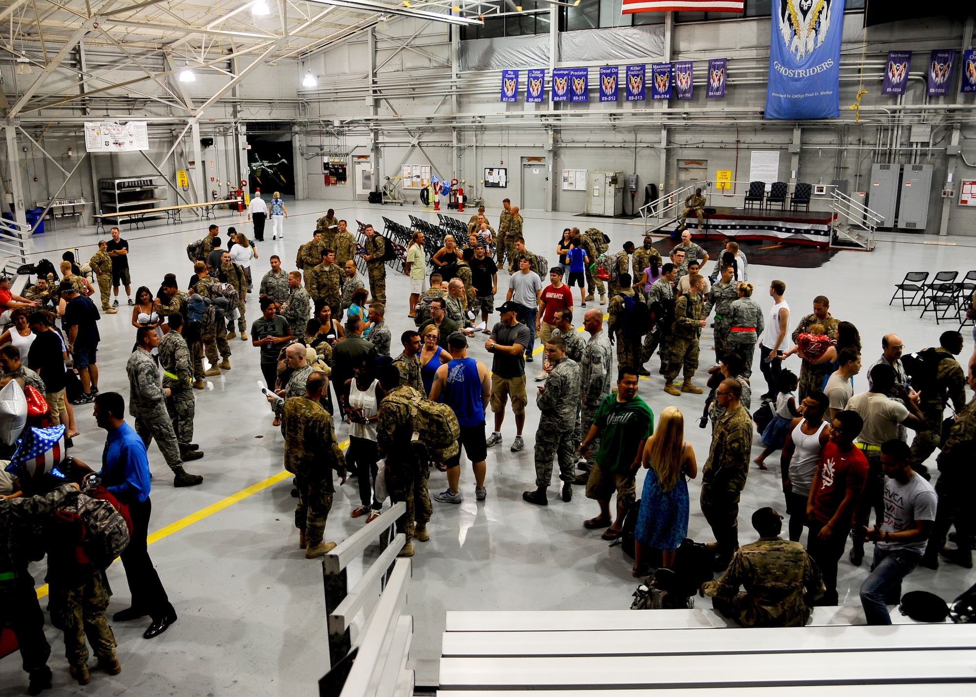 Airmen from the 4th Special Operations Squadron are greeted by friends and families after returning from deployment at the 4th SOS hangar on Hurlburt Field, Fla., June 28, 2013. The Airmen who returned are the last of deployed 4th SOS personnel resulting in the entire unit being home for the first time since 2001. (U.S. Air Force photo by Airman 1st Class Jeffrey Parkinson)