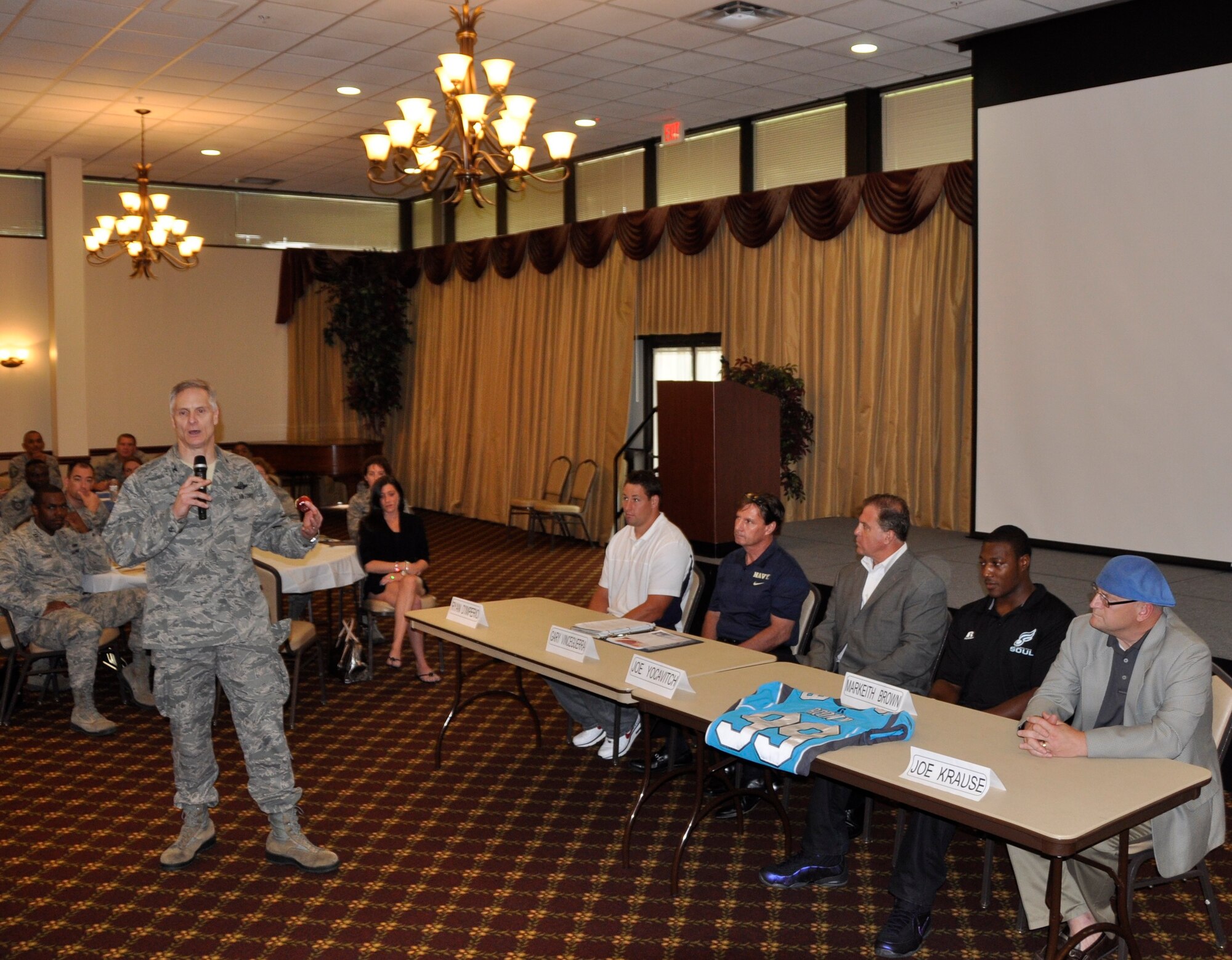 Col. Jonathan Spare, 514th Air Mobility Wing vice commander, introduces a panel consisting of sports personnel to airmen as part of  the 514th Air Mobility Wing Human Resource Development Council (HRDC) mentoring workshop held here, Jun. 22-23.  (U.S. Air Force photo by Senior Airman Chelsea Smith)
