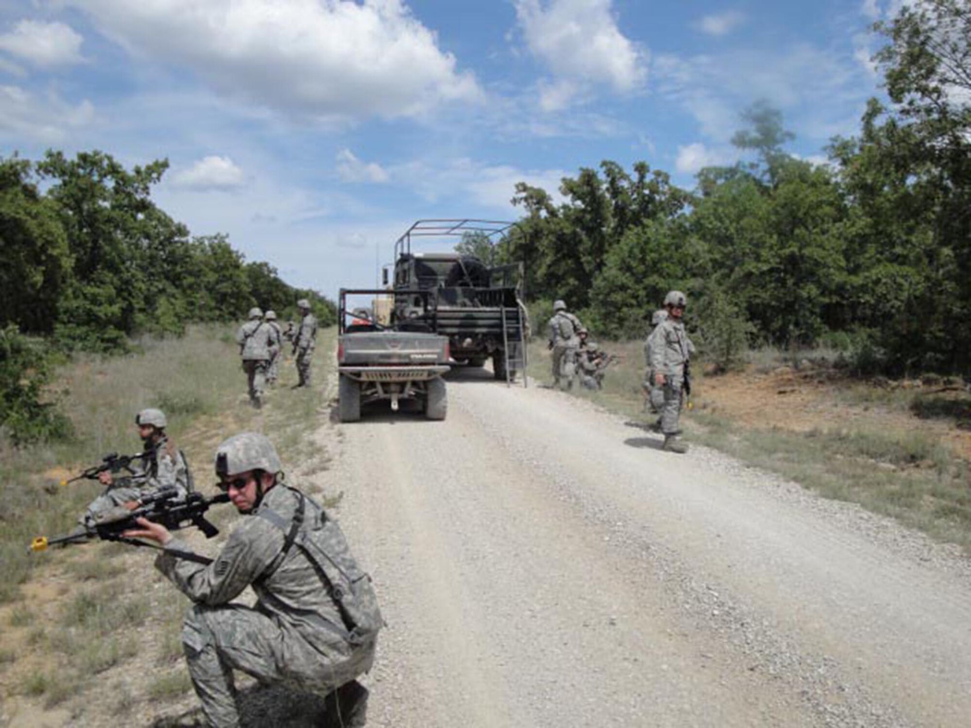 In the forefront, Tech. Sgt. Terry Taber, 446th Security Forces Squadron, Joint Base Lewis-McChord, Wash.,  provides  security after a possible improvised explosive device has been located during counter IED training at Fort Wolters, Texas June 8-23. (Courtesy photo)