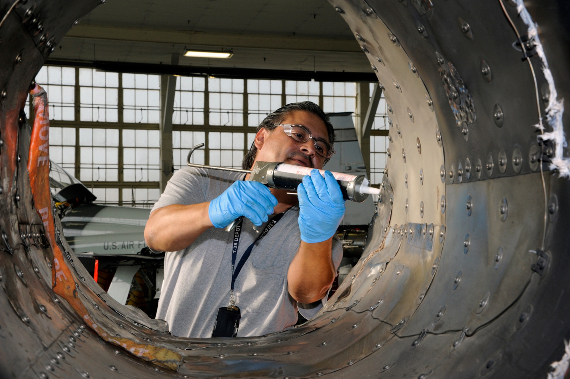 Oscar Almeida, 571 Aircraft Maintenance Squadron, works
on a T-38 Talon at Joint Base San Antonio-Randolph June 19. The 571 AMXS
started work at JBSA-Randolph in October 2010 as a separated unit from the
309 Aircraft Maintenance Group at Hill Air Force Base, Utah. The team is
charged with maintenance, repair and overhaul of all T-38 Talon aircraft in
the Air Force inventory. (U.S. Air Force photo by Don Lindsey)
