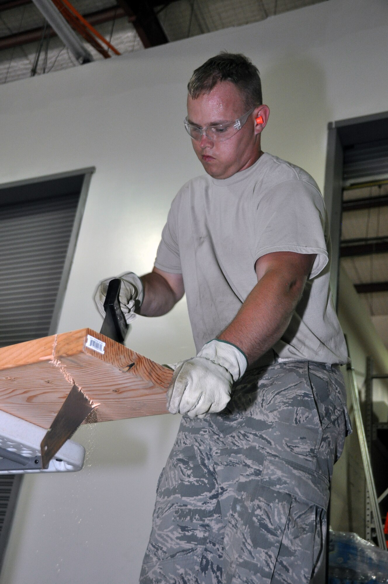 Senior Airman Shawn Levings, 442nd Civil Engineer Squadron structures technician, hones his carpentry skills during annual tour training June 18, 2013. Members of the 442nd CES train regularly in skills they will use while deployed. The 442nd CES is part of the 442nd Fighter Wing, an A-10 Thunderbolt II Air Force Reserve unit at Whiteman Air Force Base, Mo. (U.S. Air Force photo by Senior Airman Wesley Wright/Released)