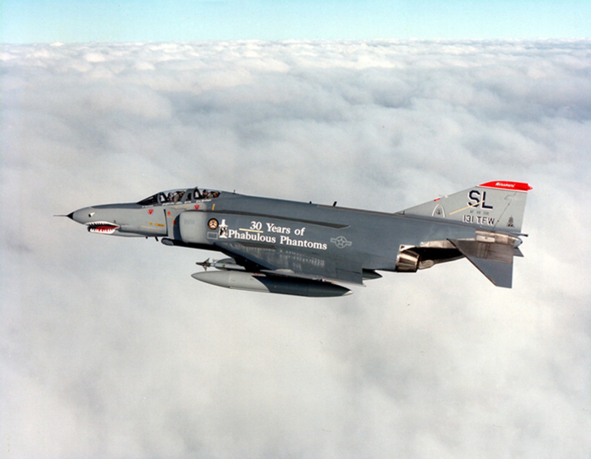 A McDonnell Douglas F-4-E of the 131st Tactical Fighter Wing, Missouri Air National Guard, flies high in 1989.   It is painted in celebration of the 30th anniversary of the F-4 Phantom.  (131st Bomb Wing file photo/RELEASED)