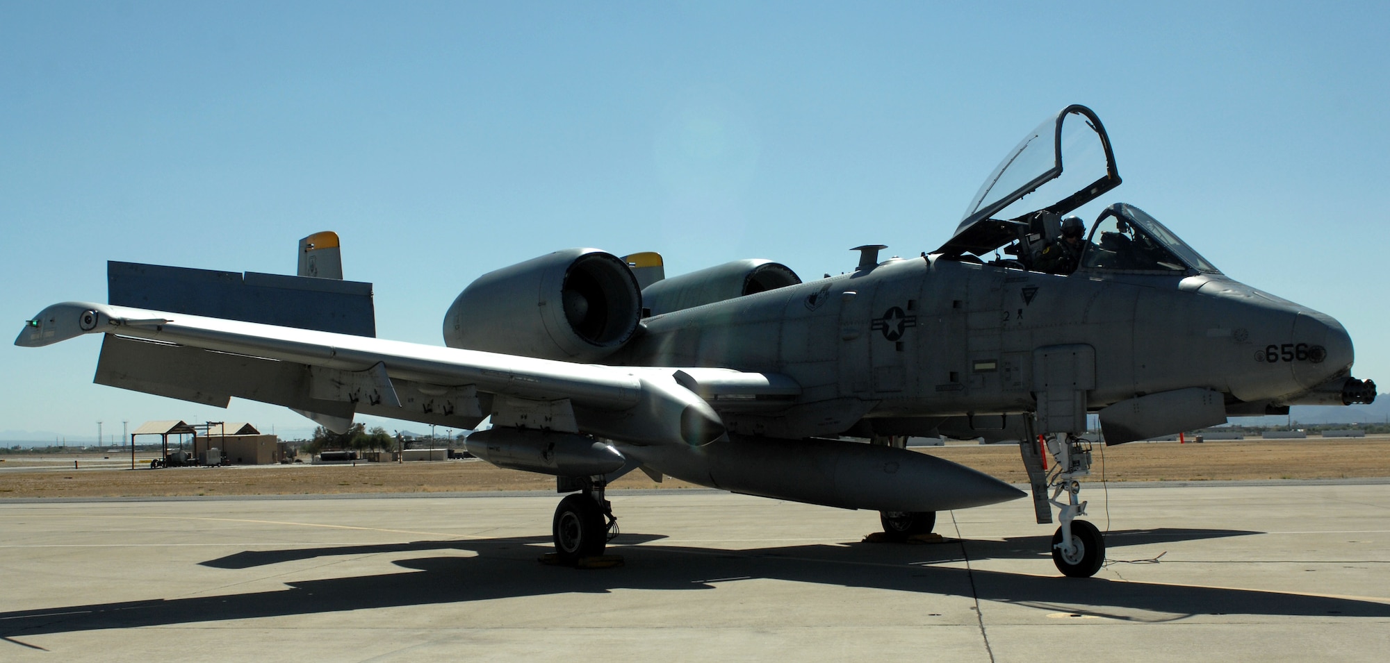 A U.S. Air Force A-10 aircraft and its pilot sit on the flightline at Davis-Monthan Air Force Base, Ariz., May 23, 2013. Maj. Matthew Kaercher ,355th Operations Group fighter pilot, was flying an A-10 when he earned the Pilot Safety Award of Distinction for the 355th Fighter Wing and 12th Air Force (Air Forces Southern) for emergency actions taken during a training flight May 21, 2013. (U.S. Air Force photo by Airman 1st Class Betty R. Chavalier/Released)