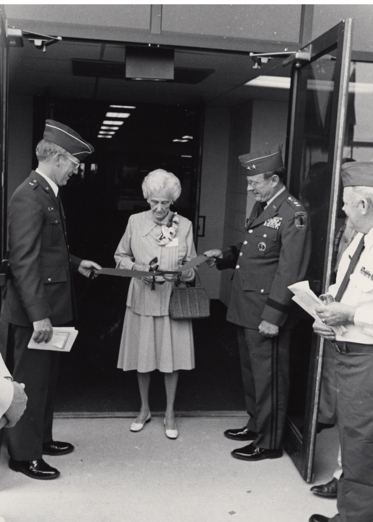 Betty Robertson-Uhl, one of the nation’s earliest pilots, takes part in the ribbon cutting ceremony at the dedication of the Missouri Air National Guard’s Robertson Building 131 at Lambert Air National Guard Base, Aug 22, 1922.  She is the sister of the Robertson brothers, who founded the 110th Observation Squadron on June 23, 1923.  (131st Bomb Wing file photo/RELEASED)